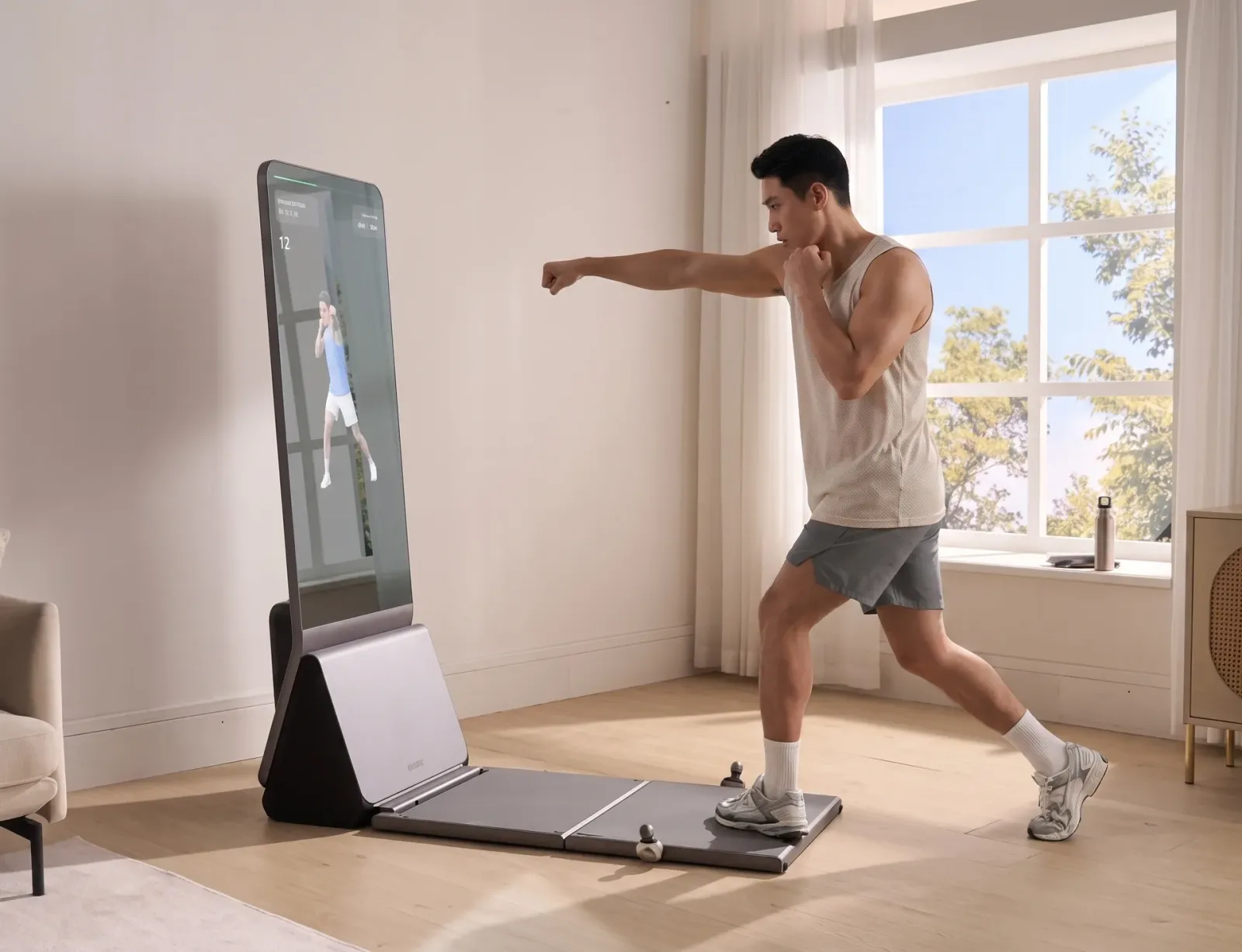Man boxing with on-screen form guidance